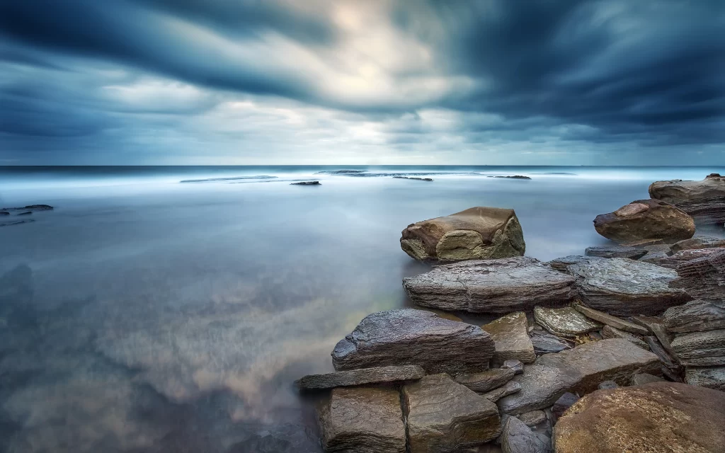 Cloudy Sky Ocean Rocks Misty Horizon