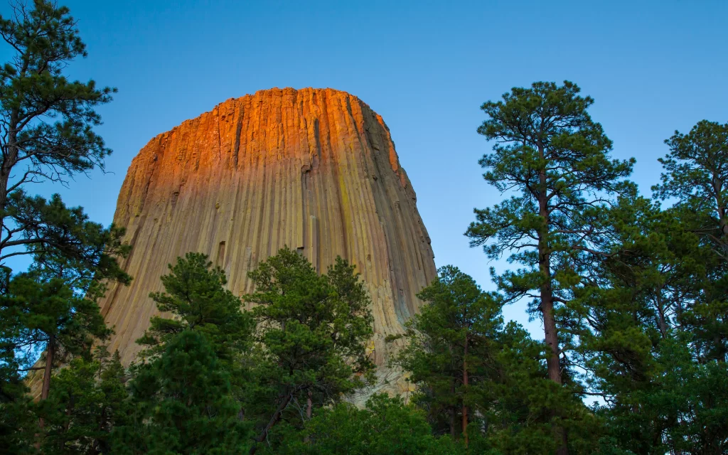 Sunset Tower Rock Formation Pine Trees Blue Sky