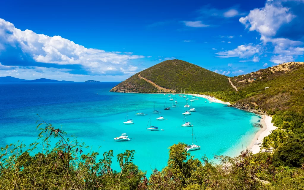 Tropical Beach Clear Water Boats Green Hills Blue Sky
