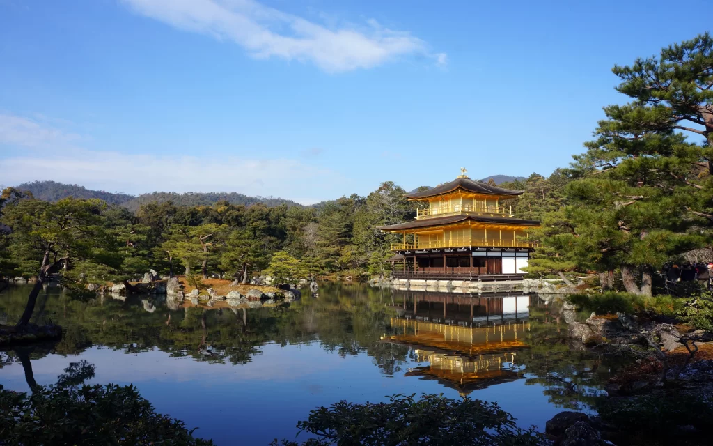 Golden Pavilion Temple, Reflective Pond, Traditional Architecture, Lush Trees, Blue Sky, Scenic Landscape, Kyoto, Japan