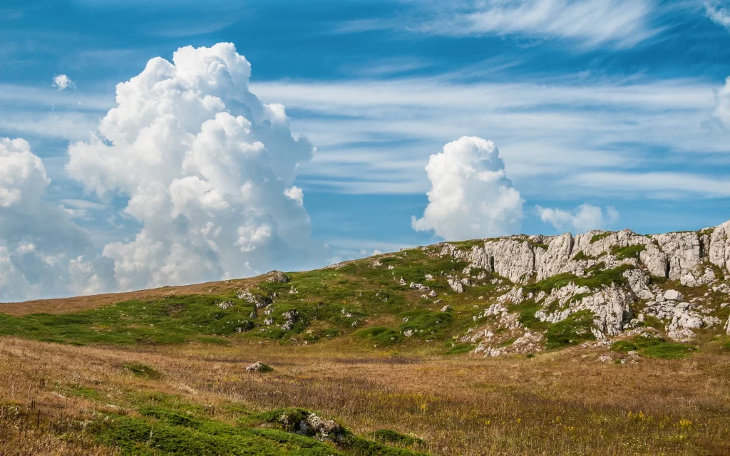 Clouds Blue Sky Mountain Green Grass Rocky Terrain