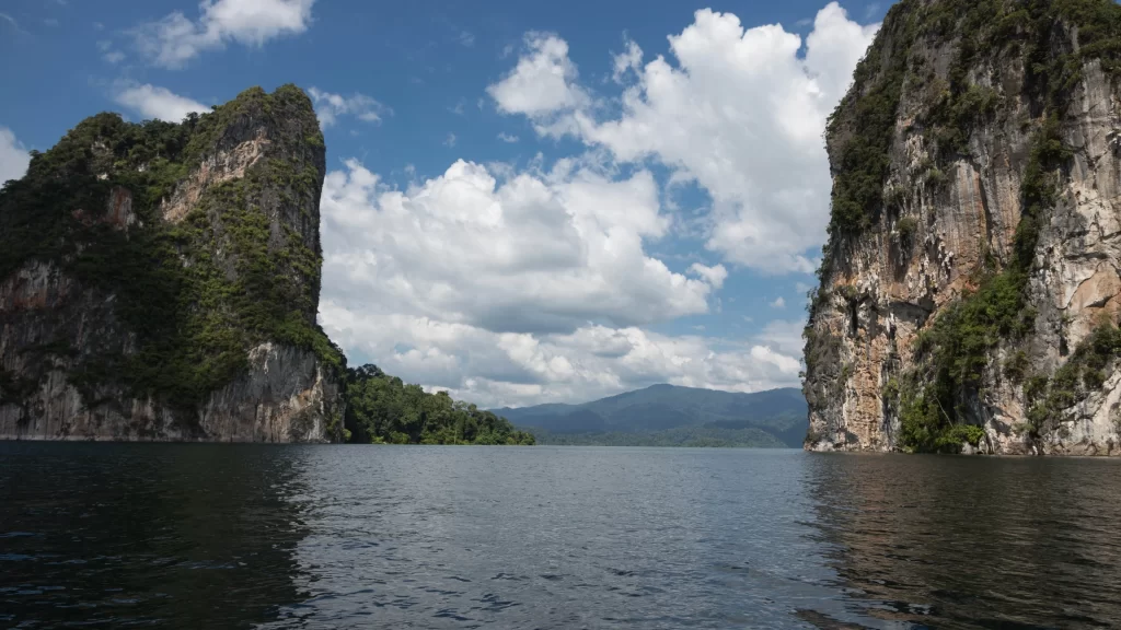 water mountains sky clouds cliffs nature