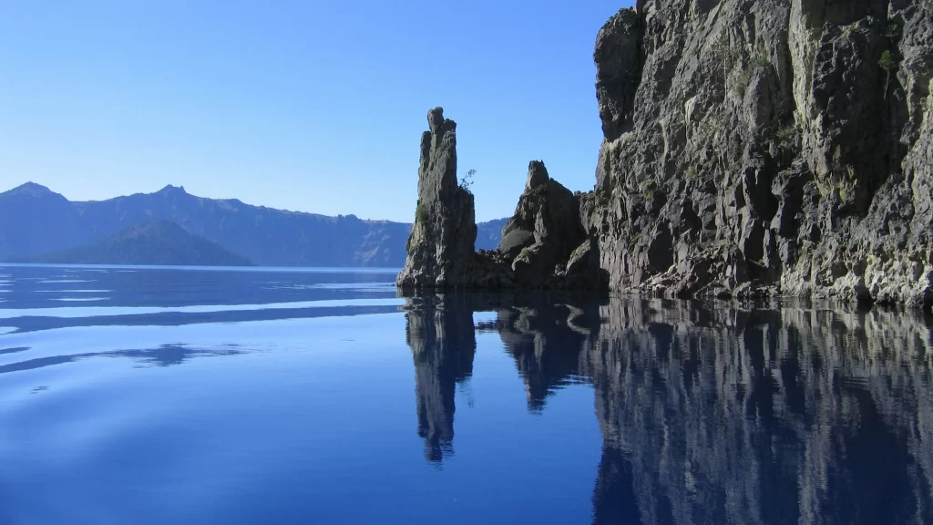 water rock reflection mountain sky nature