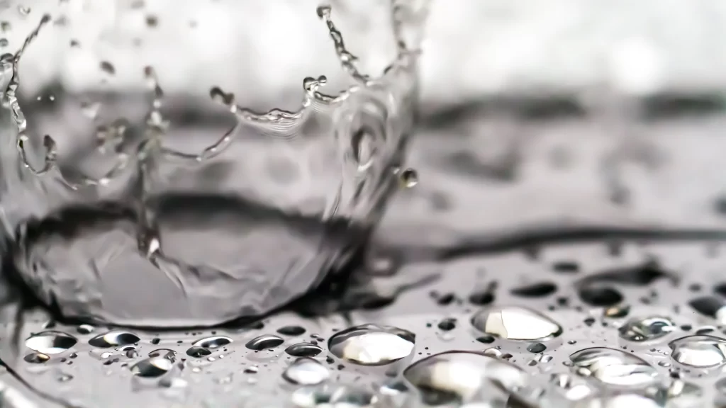 water splash droplets clear surface