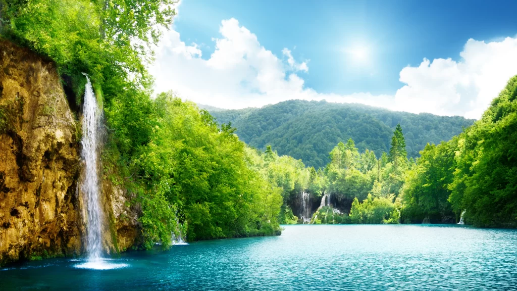 waterfall lake forest mountain sun