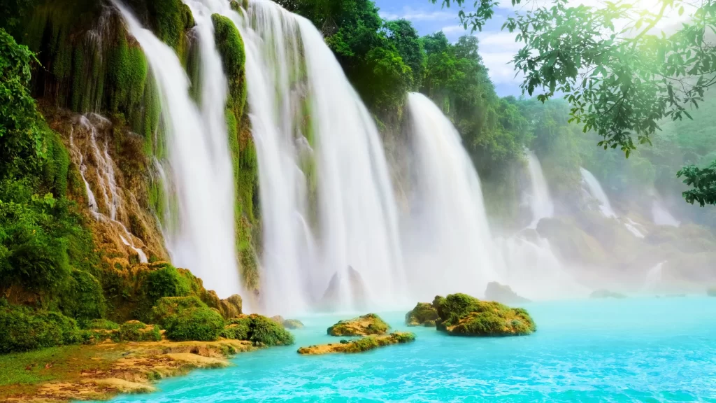waterfall nature greenery blue pool sunlight mist serene