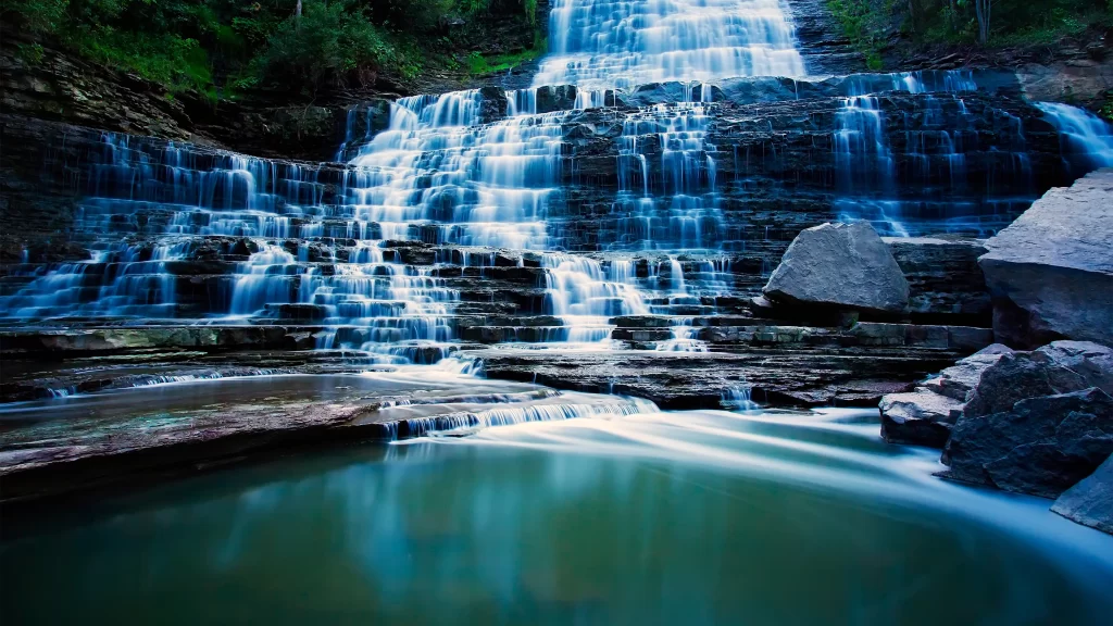 waterfall nature rock serene landscape flowing