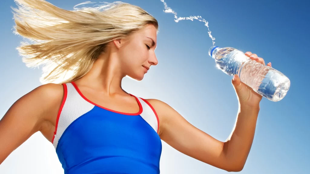 woman water bottle blue sky sports