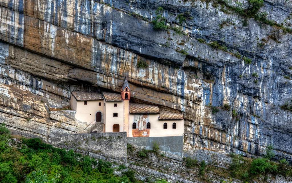 Mountainous Landscape Ancient Monastery Stone Architecture Natural Rock Green Vegetation Historical Site