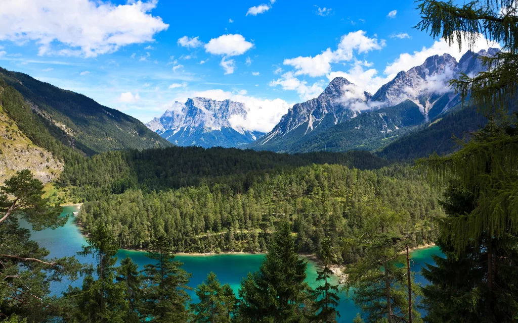 Mountainous Landscape Clear Lake Lush Forest Blue Sky Clouds Natural Beauty