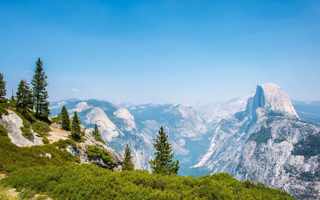 Mountainous Landscape Clear Sky Granite Peaks Evergreen Trees Scenic View