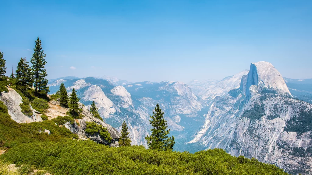 Mountainous Landscape Clear Sky Granite Peaks Evergreen Trees Scenic View
