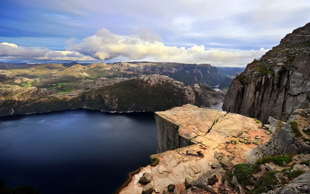 Mountainous Landscape Deep Blue Lake Rocky Cliff Cloudy Sky Natural Beauty Scenic View
