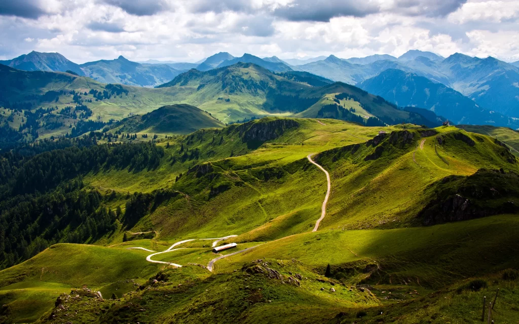 Mountainous Terrain Greenery Pathway Cloudy Sky Scenic