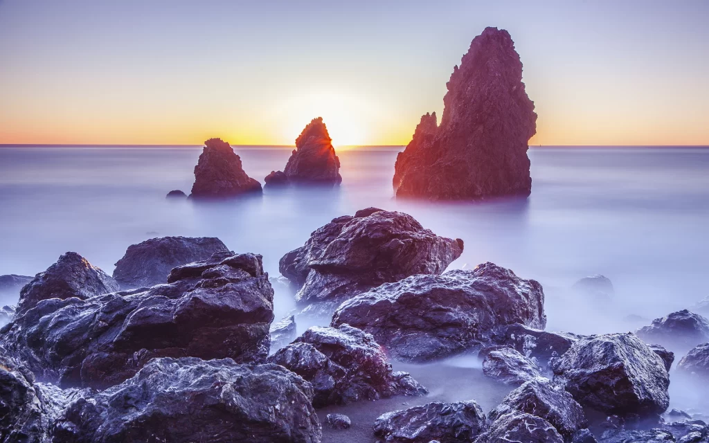 Sunset Ocean Rocks Misty Horizon