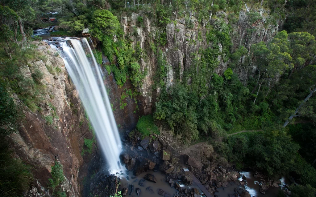 Waterfall Lush Greenery Rocky Cliff Nature Scenic